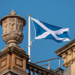 Scottish flag (blue with a white cross) on top of a building