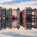 Dutch style houses reflecting in canal water